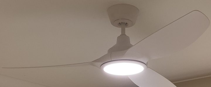 Improve Heating Efficiency & Save Money White Jota ceiling fan with light switched on.